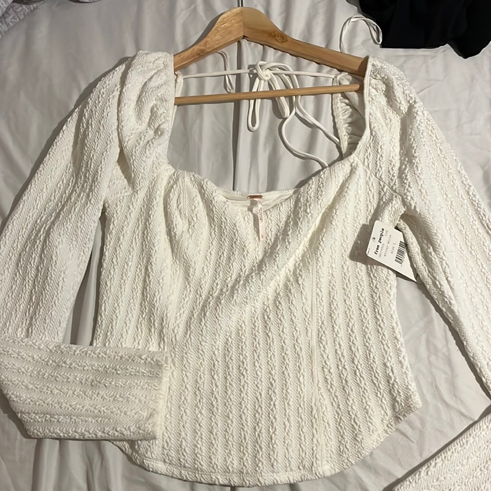 Brand new long sleeve open in the back